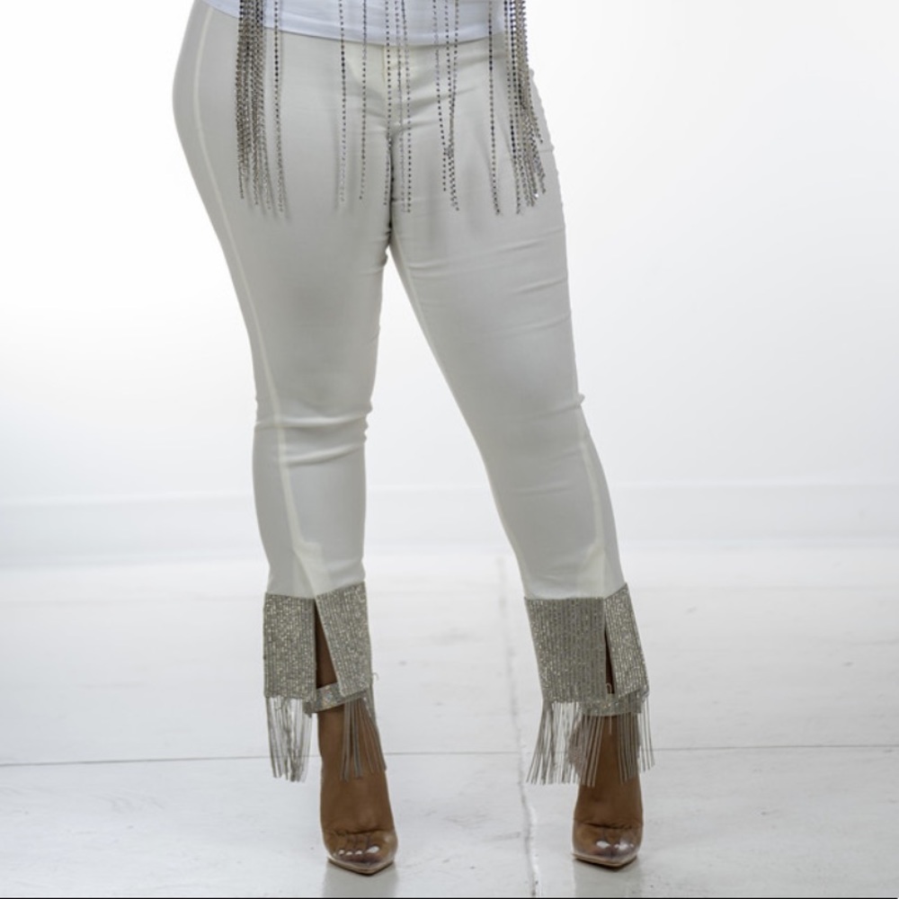 Off white high waisted pants w/ Diamonds at ankle.
